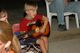 Jerome with his guitar singing by the campfire.