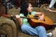 Karen playing the guitar on Thanksgiving 2005